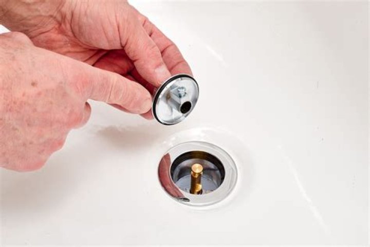How do you remove a rapid fit drain stopper?