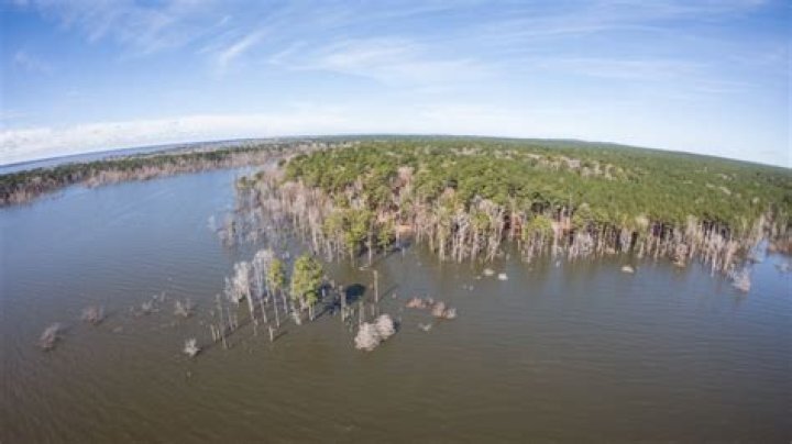 What river feeds Lake Sam Rayburn?