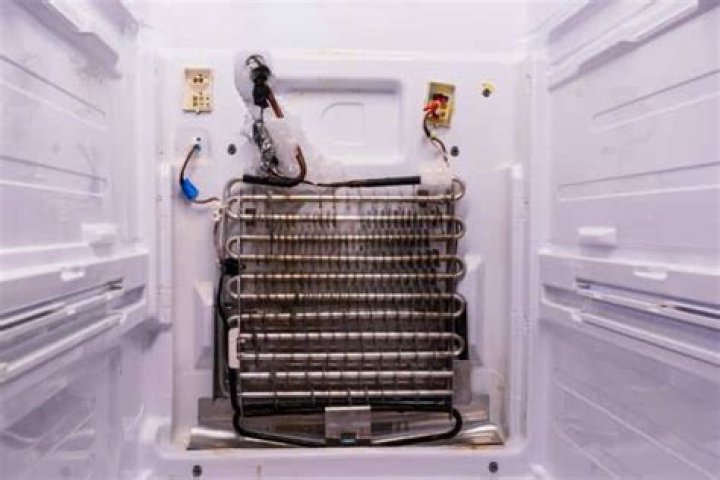 Why is my Kenmore fridge leaking water inside?